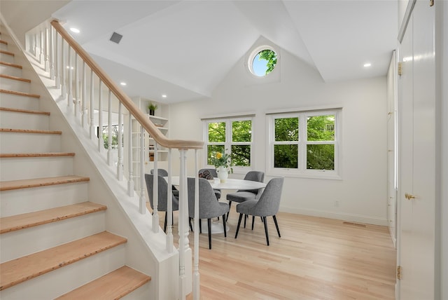 dining space with visible vents, recessed lighting, stairway, light wood finished floors, and baseboards