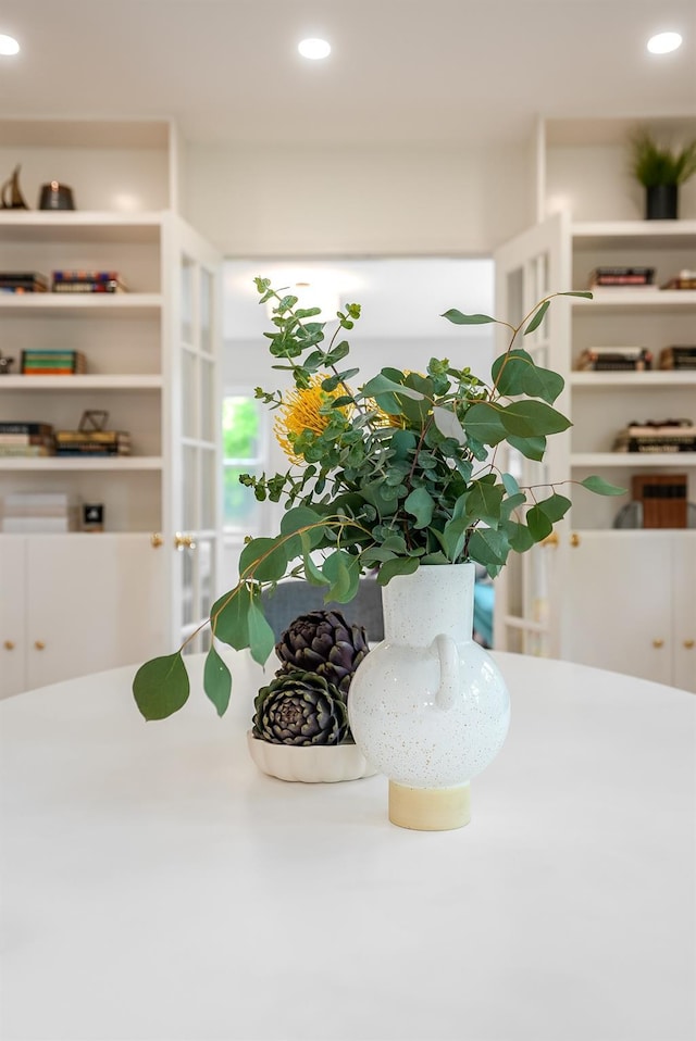 interior details featuring white cabinets and recessed lighting
