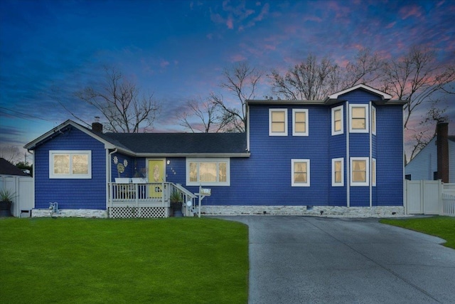 view of front of property with a yard