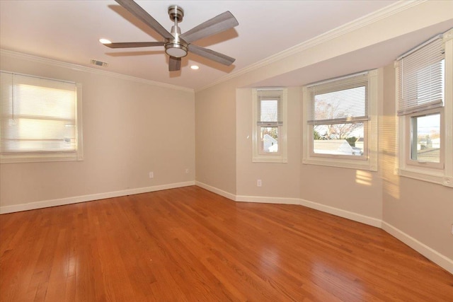 unfurnished room with crown molding, hardwood / wood-style floors, and ceiling fan