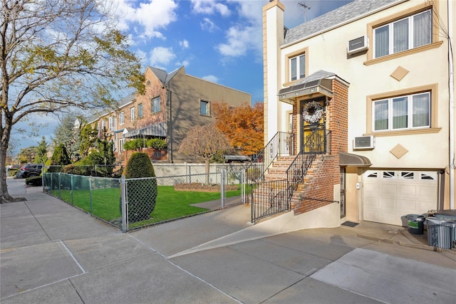 view of front facade featuring a front yard and a garage