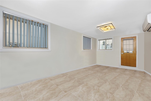 spare room with a wall mounted air conditioner