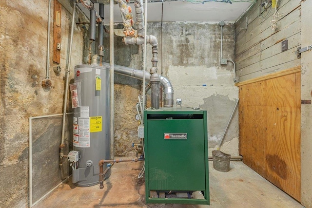 utility room with water heater and a heating unit