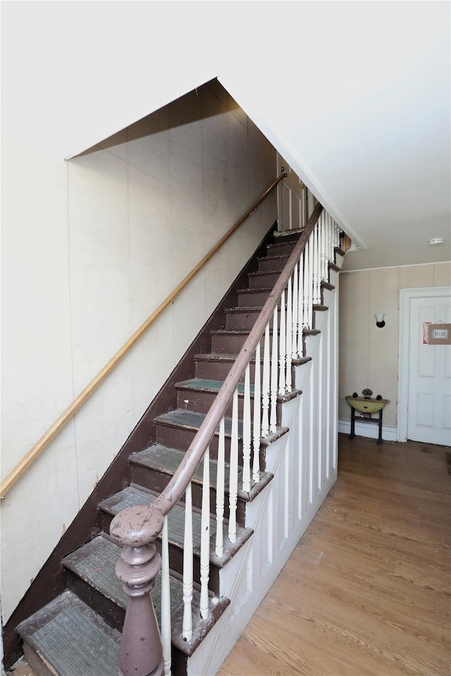 staircase featuring hardwood / wood-style floors