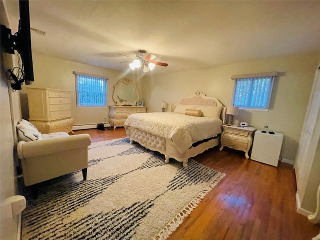 bedroom featuring ceiling fan and dark hardwood / wood-style floors