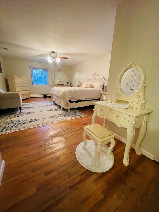 bedroom with ceiling fan and wood-type flooring