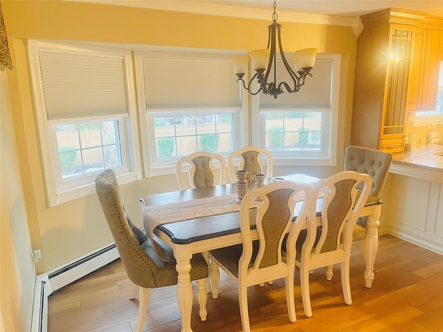 dining room featuring a baseboard radiator, a notable chandelier, ornamental molding, and light hardwood / wood-style floors