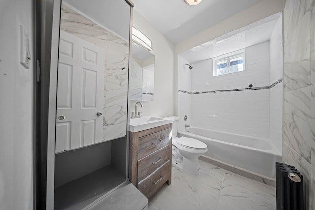 full bathroom with tiled shower / bath combo, vanity, and toilet