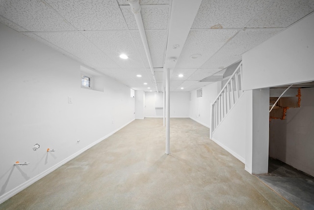 basement featuring a paneled ceiling