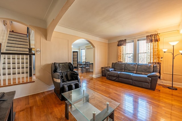 1059 Neill Ave, Bronx, NY 10461 - living area with arched walkways, healthy amount of natural light, and wood-type flooring