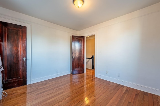 spare room with light hardwood / wood-style floors