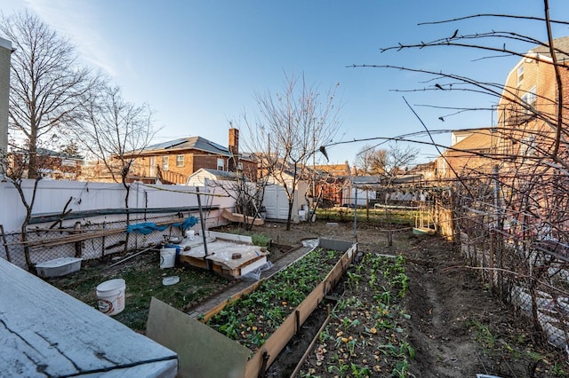 1059 Neill Ave, Bronx, NY 10461 - fenced backyard with a vegetable garden and a storage shed