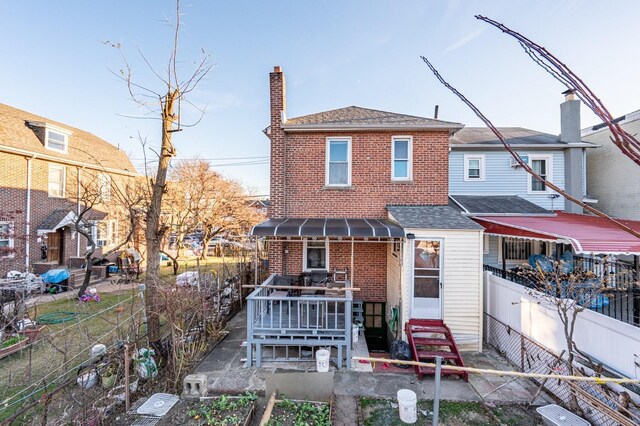 1059 Neill Ave, Bronx, NY 10461 - back of house with brick siding, entry steps, a chimney, and a shingled roof