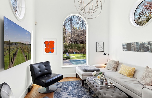 living room featuring hardwood / wood-style floors and an inviting chandelier