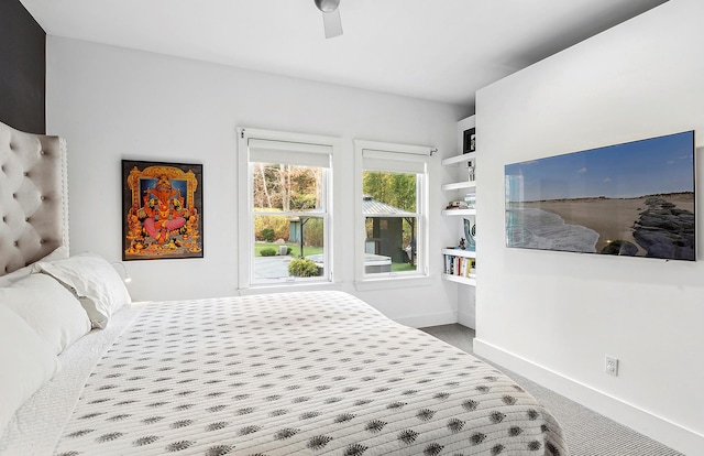 carpeted bedroom featuring ceiling fan