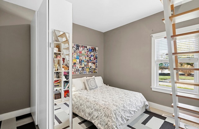 bedroom featuring multiple windows