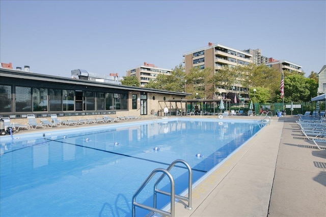 view of swimming pool featuring a patio area