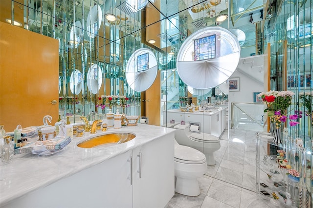 45 Bristol Dr, Manhasset, NY 11030 - full bath featuring vanity, marble finish floor, and toilet