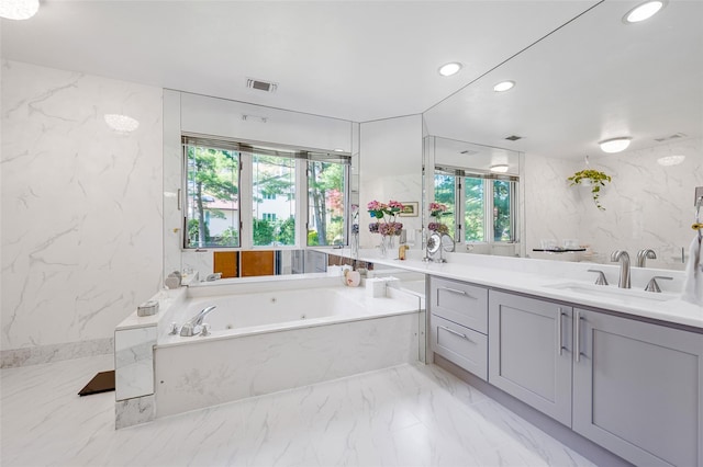 45 Bristol Dr, Manhasset, NY 11030 - bathroom with visible vents, vanity, marble finish floor, recessed lighting, and a whirlpool tub