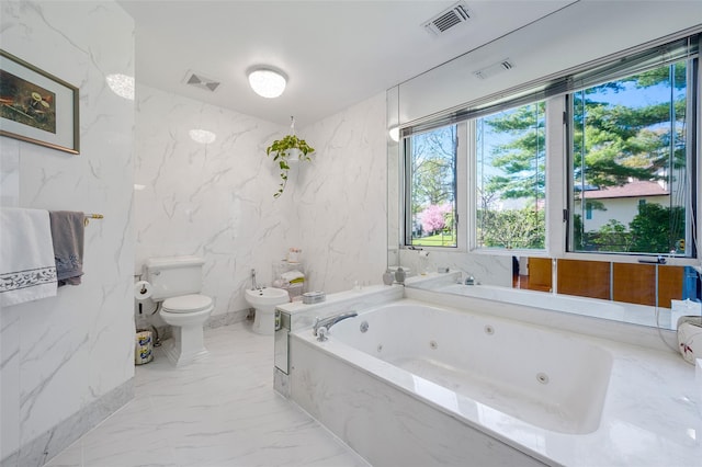 45 Bristol Dr, Manhasset, NY 11030 - full bathroom featuring visible vents, marble finish floor, toilet, a whirlpool tub, and a bidet