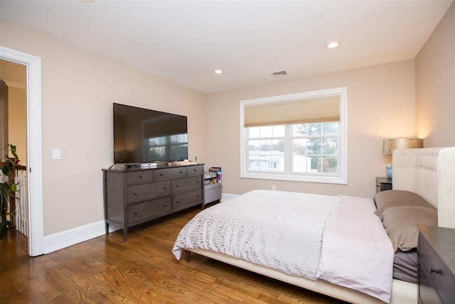 bedroom with dark wood-type flooring