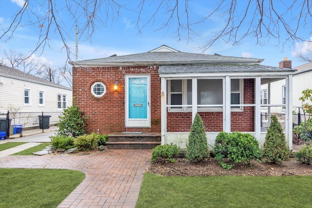 bungalow with a front yard