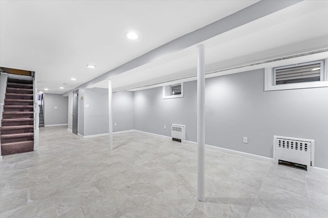 basement featuring radiator heating unit