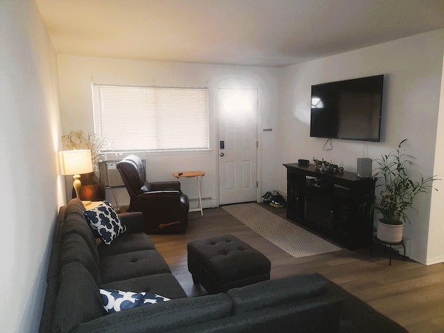 living room featuring hardwood / wood-style floors and baseboard heating