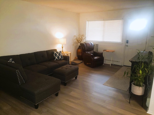 living room with hardwood / wood-style flooring and baseboard heating