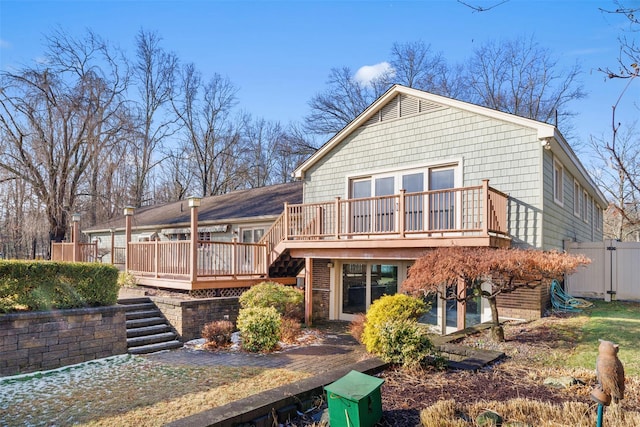 back of property featuring a deck