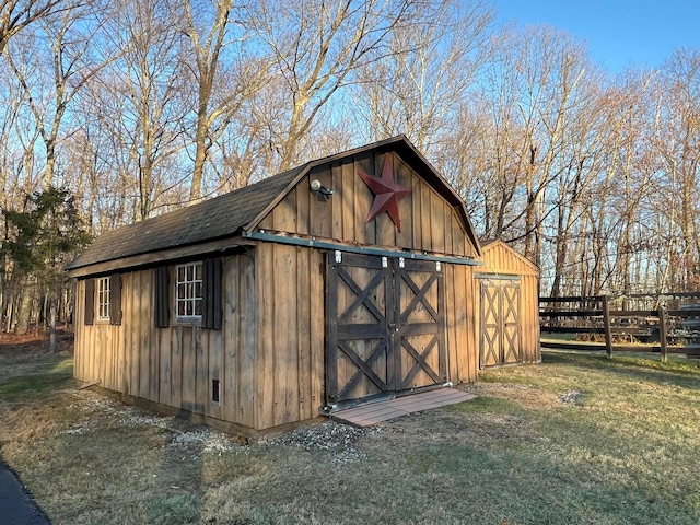 view of outbuilding with a yard