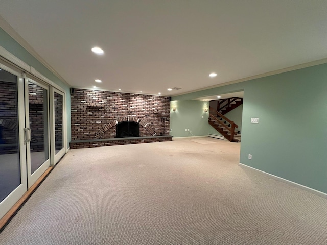 unfurnished living room featuring carpet floors, a brick fireplace, crown molding, and brick wall