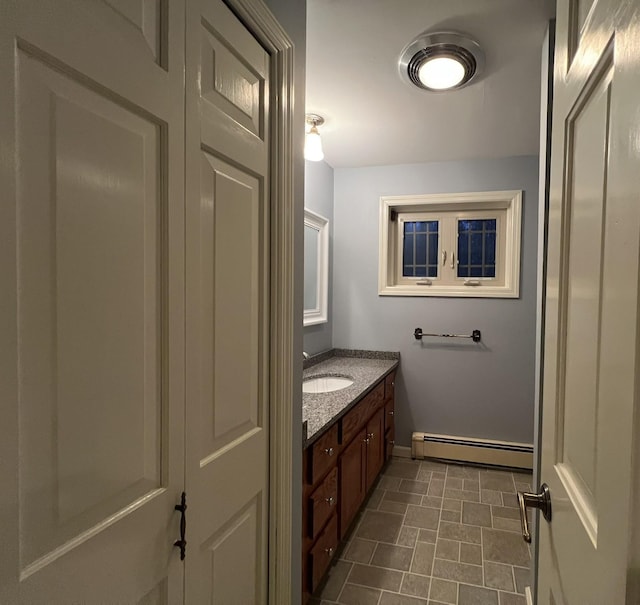 bathroom featuring vanity and a baseboard heating unit