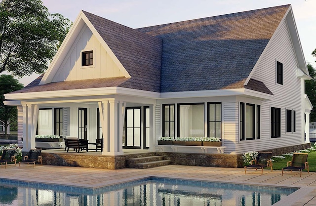 rear view of house with french doors and a patio