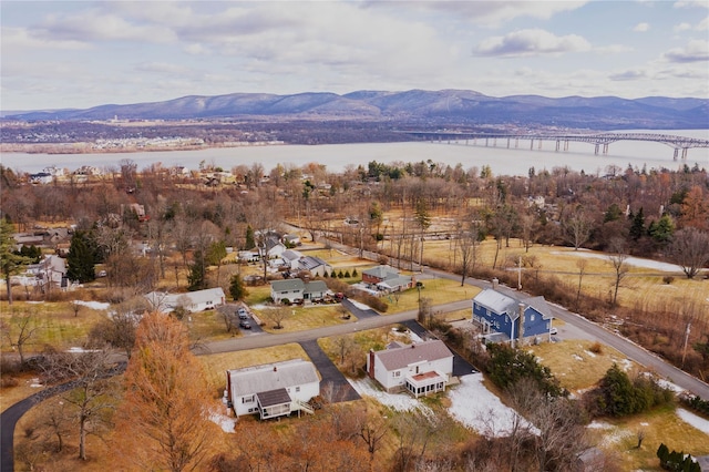 birds eye view of property featuring a water and mountain view