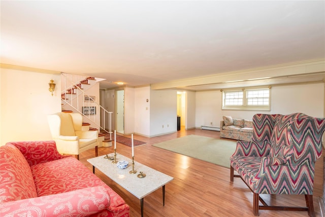 living room with hardwood / wood-style floors, baseboard heating, and ornamental molding