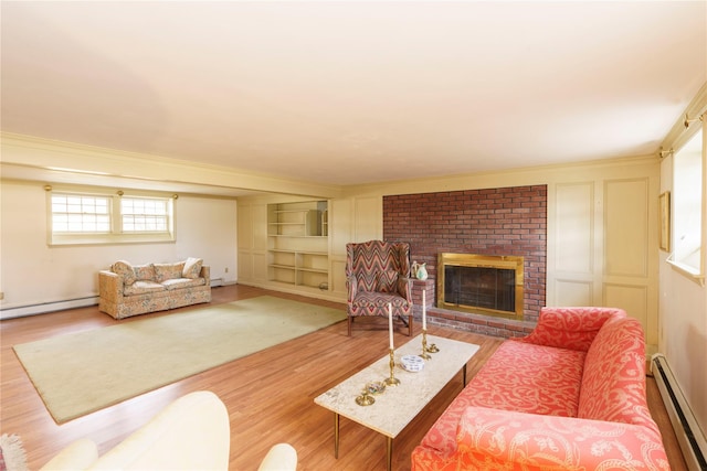 living room featuring a brick fireplace, crown molding, hardwood / wood-style floors, and a baseboard radiator