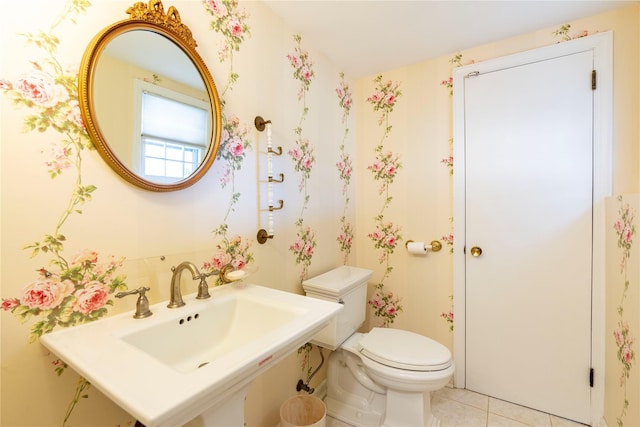 bathroom featuring tile patterned floors, toilet, and sink