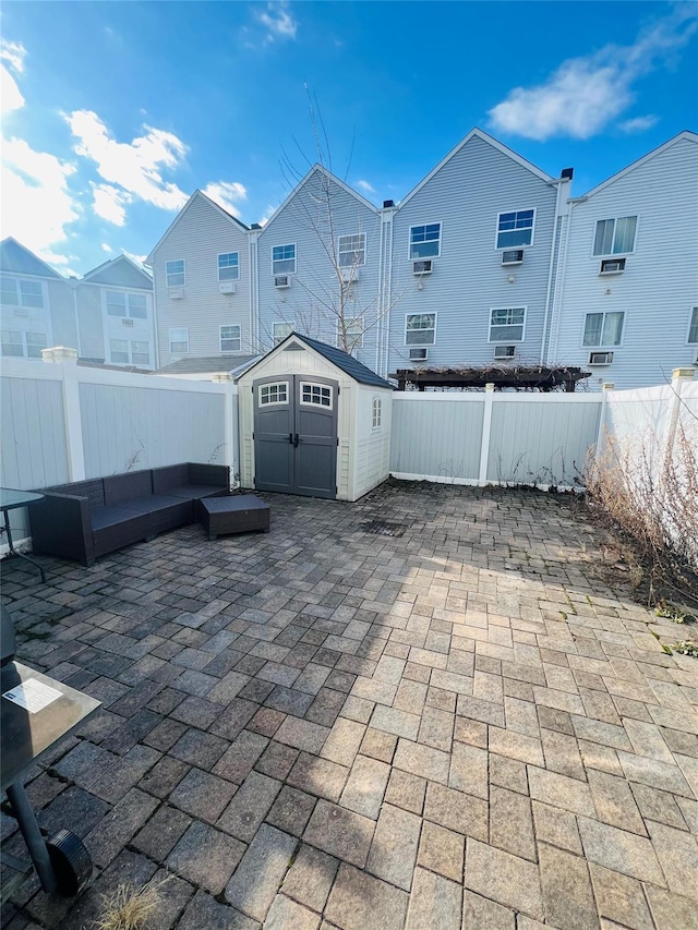 view of patio / terrace with a storage unit