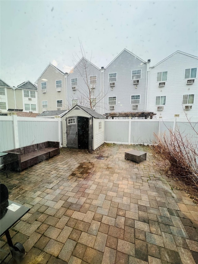 view of patio with a shed