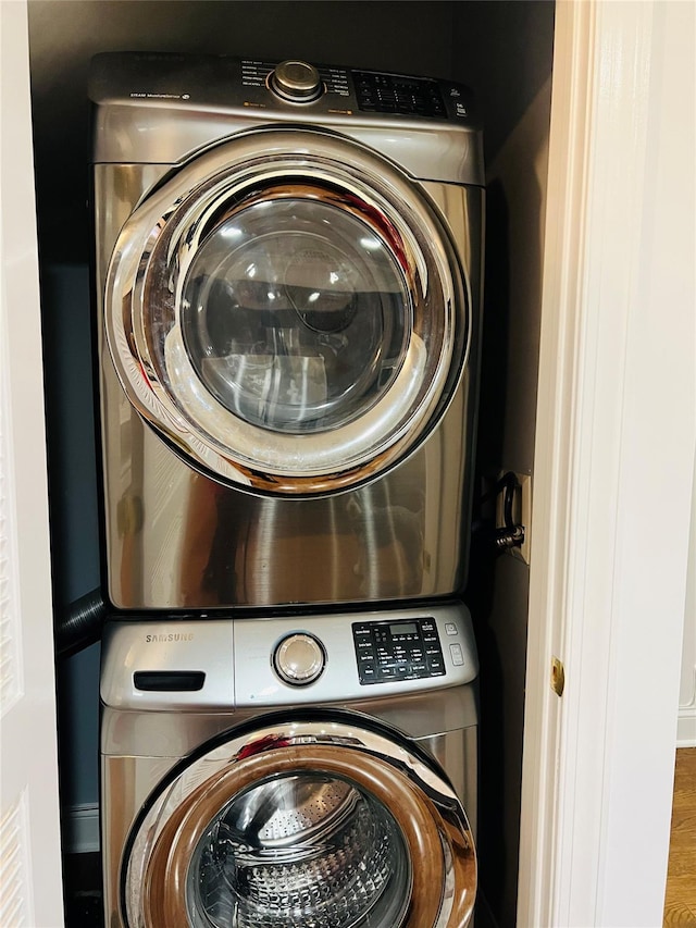 washroom with stacked washer and dryer