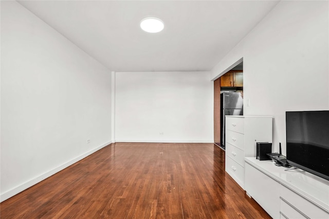 unfurnished living room featuring dark wood-type flooring