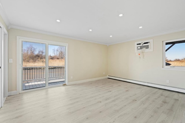 spare room featuring light hardwood / wood-style flooring, ornamental molding, a wall mounted air conditioner, and a baseboard heating unit