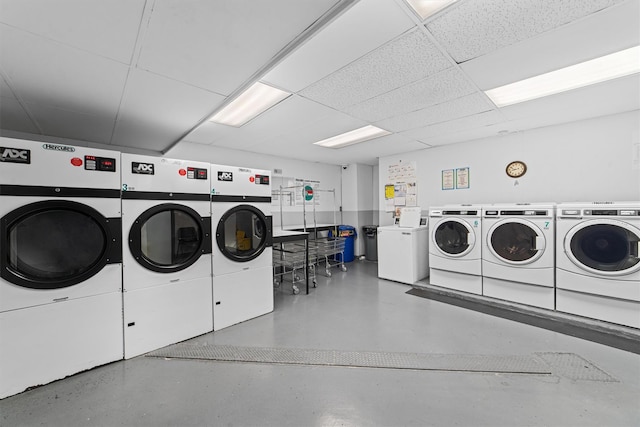 clothes washing area featuring washer and dryer