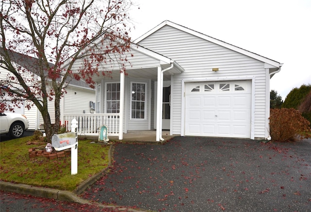 view of front facade featuring a porch and a garage