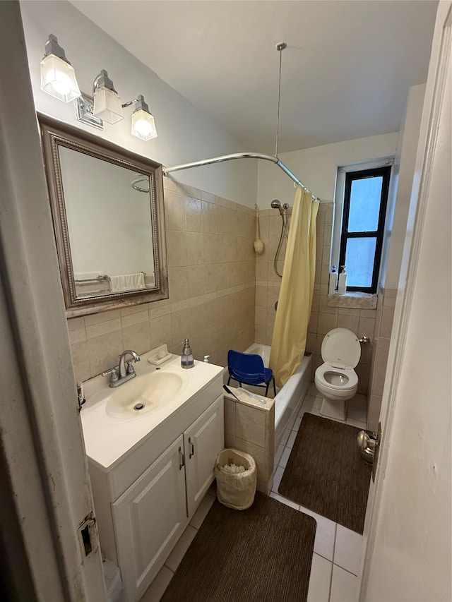 full bathroom with vanity, tile patterned floors, decorative backsplash, toilet, and tile walls