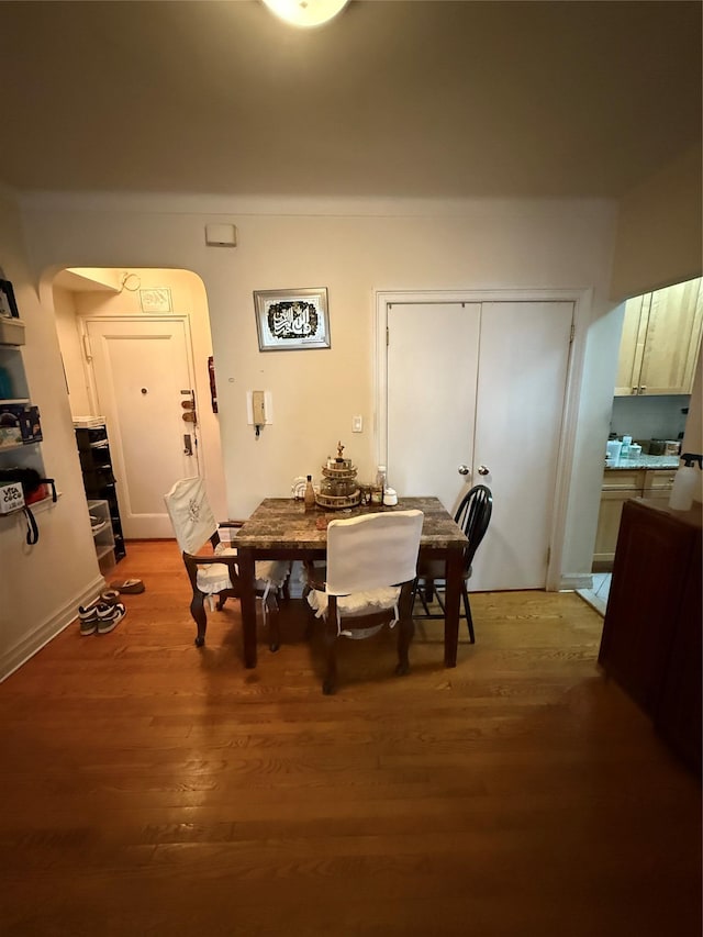 dining space with hardwood / wood-style flooring