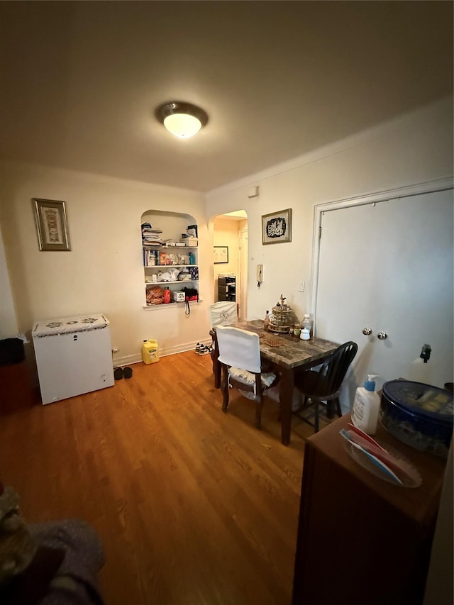 dining area featuring wood-type flooring