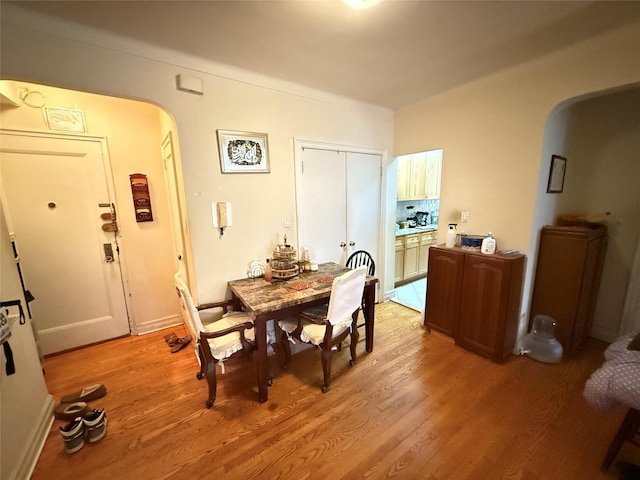 dining space with light hardwood / wood-style flooring