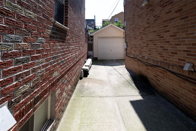 view of home's exterior with a garage and an outdoor structure